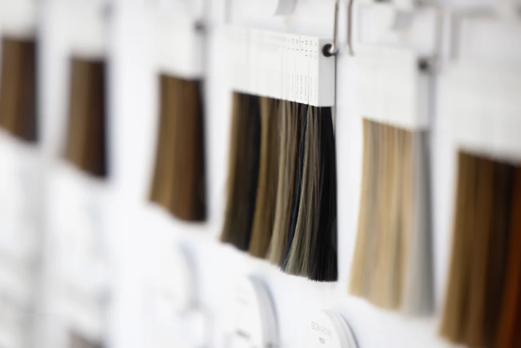 Assorted shades of hair extensions displayed for selection.