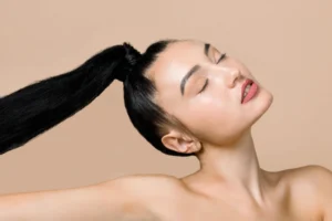 Confident woman showing results after hair treatment