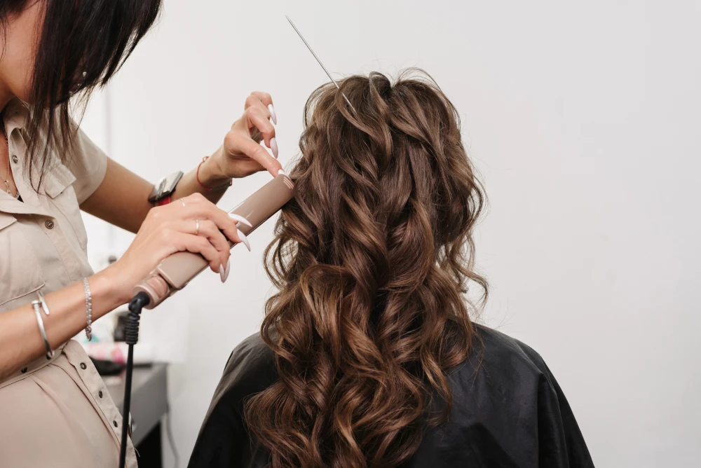Bride with floral accessories in an elegant updo hair styling.