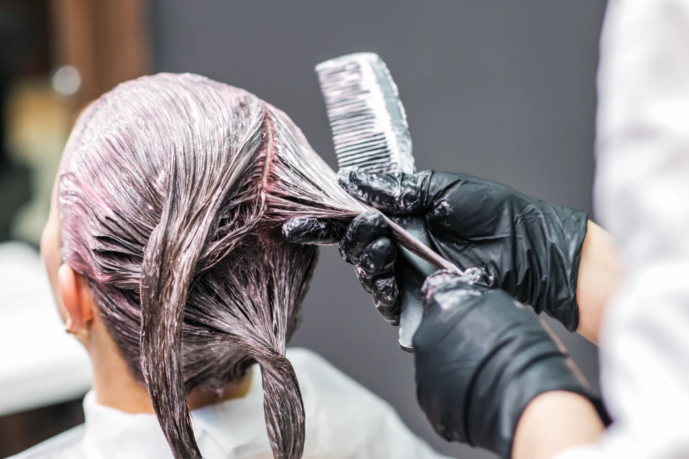 Hair treatment being applied in a salon session